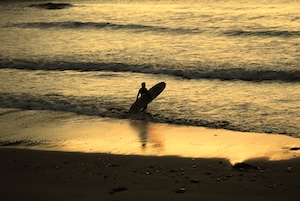 Surfer at dusk